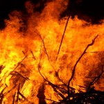 A yellow and orange inferno with a black sky backdrop